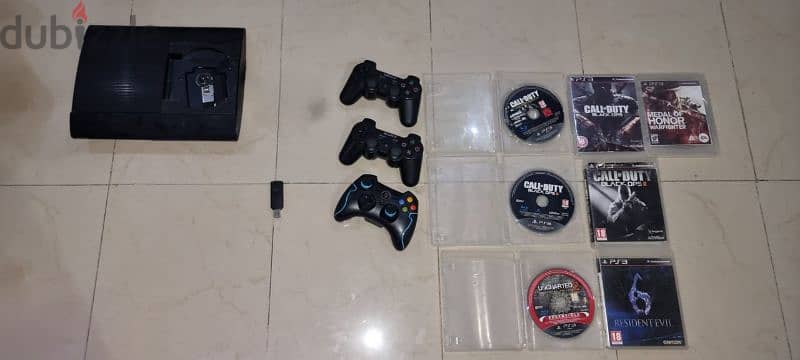 Ps3 jailbraked with 3 controller and game cds 7