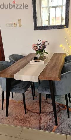 dining table with 4 chairs from pan Emirates. 0