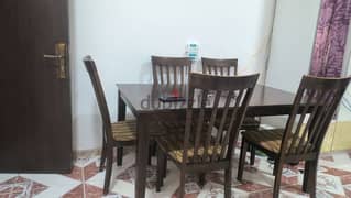 wooden dining table with six chair in good condition