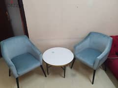 2 chairs with marble table