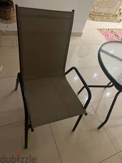 new table with 4 chairs and umbrella