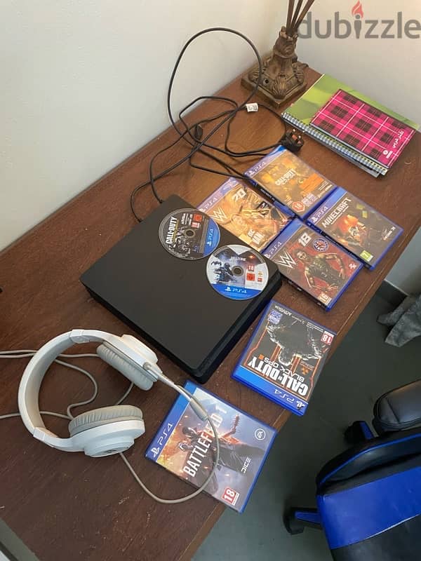 ps4 with a lot of games and a head mic but no controller 0