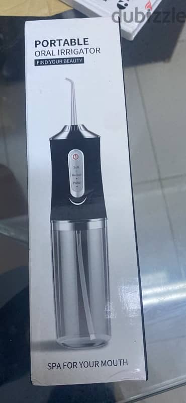 BRAND NEW UNUSED PORTABLE ORAL IRRIGATOR 0