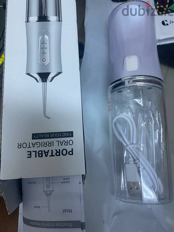 BRAND NEW UNUSED PORTABLE ORAL IRRIGATOR 1