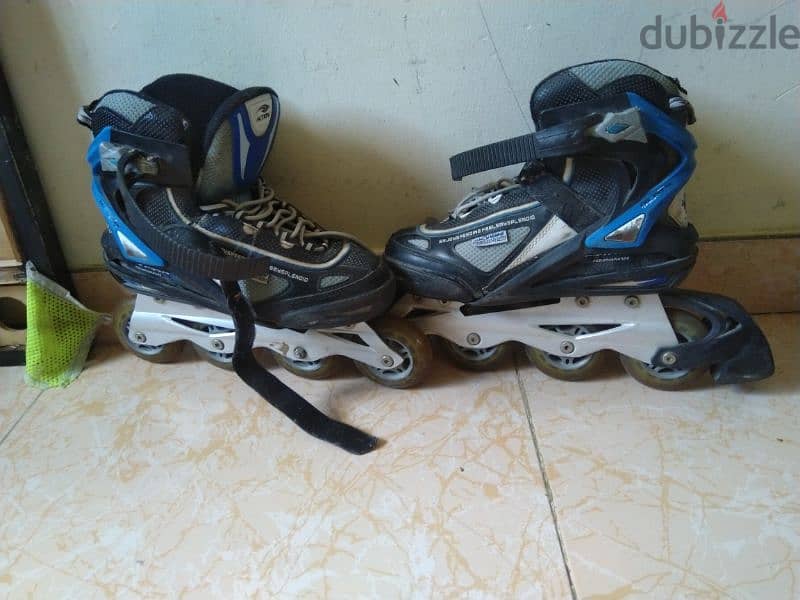 skating shoes. board. and scooter for 7 rial 0