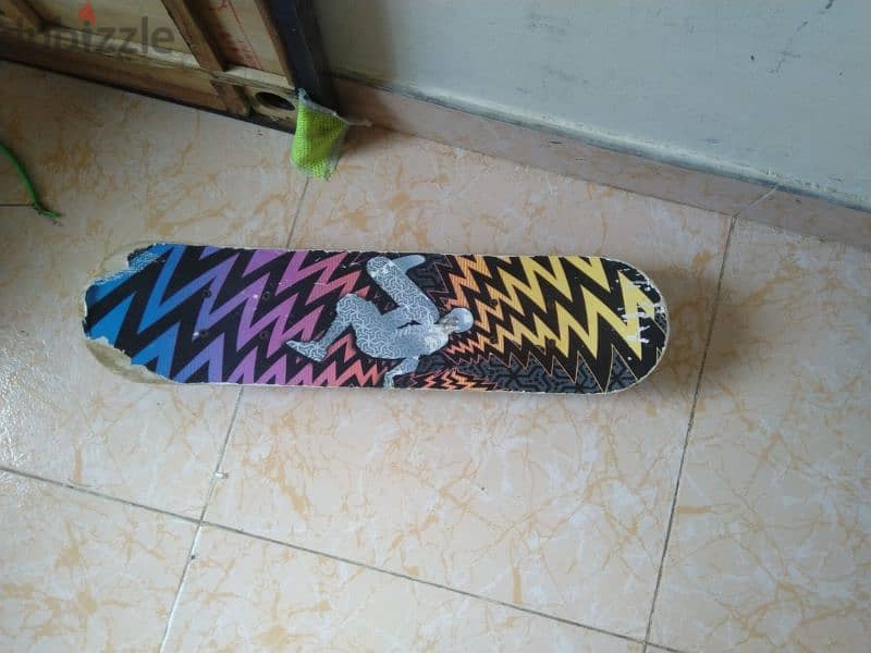 skating shoes. board. and scooter for 7 rial 1