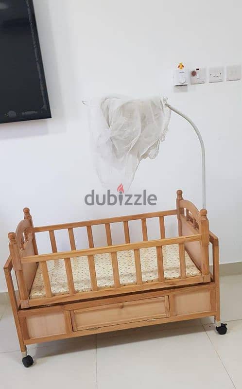 Baby's wooden cradle 1