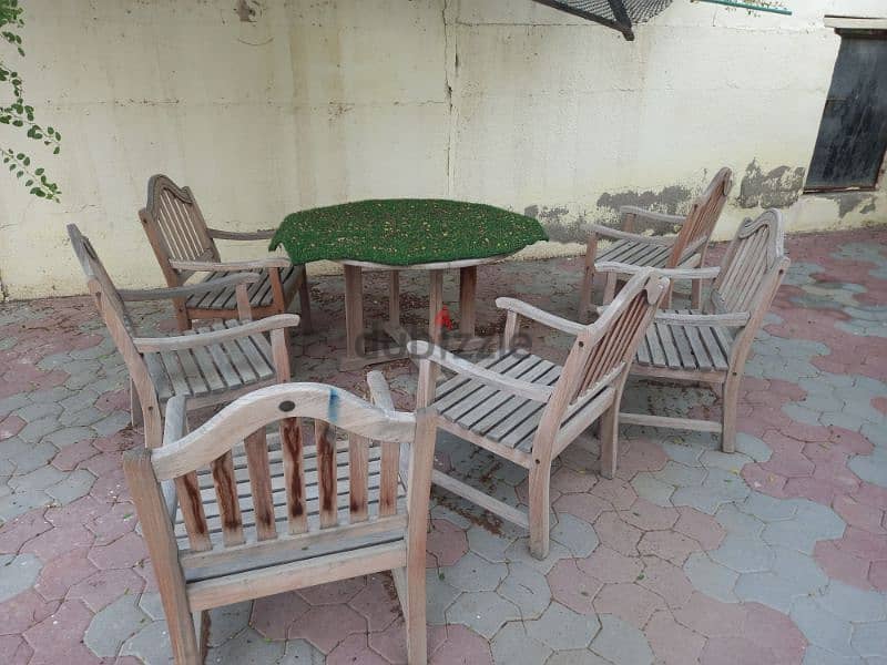 out door wooden chairs and Round table 6+1used 1