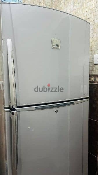 well condition fridge and washing machine for sale only 120 rial