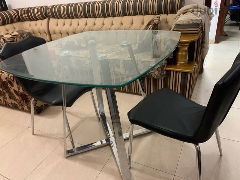 glass table with two chairs 0