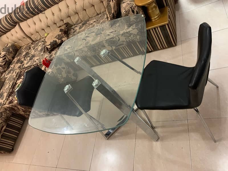 glass table with two chairs 1