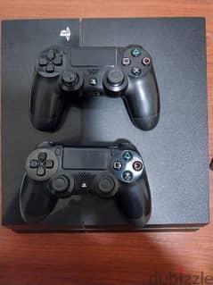 PS4 with 2 controllers and 6 games 0