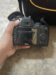 Nikon d3000 with out lens only camera and bag 0