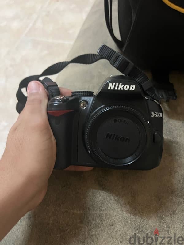 Nikon d3000 with out lens only camera and bag 1