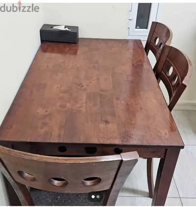 Table with Chairs and Cupboard