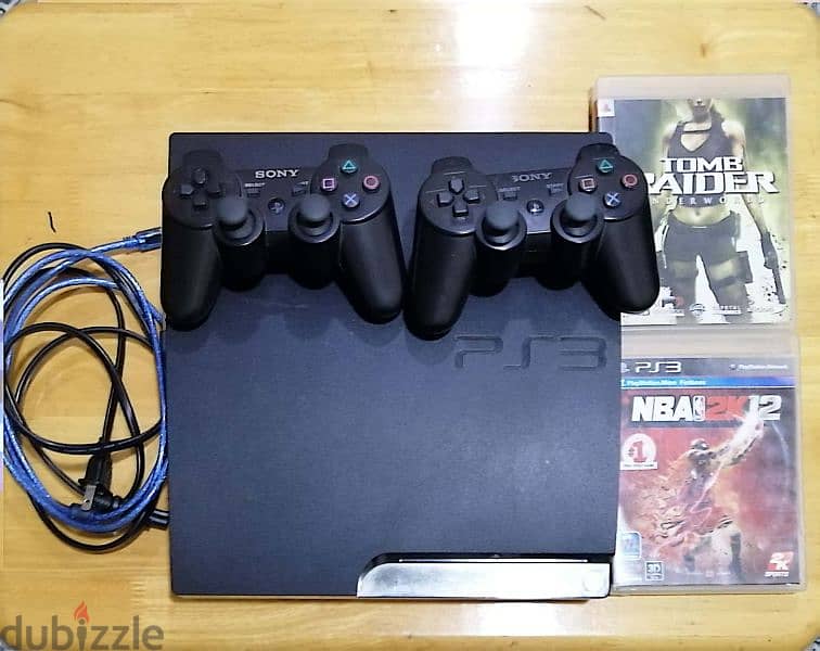 Sony PlayStation 3 silm, 150GB with Two controllers and Two games. . . 0