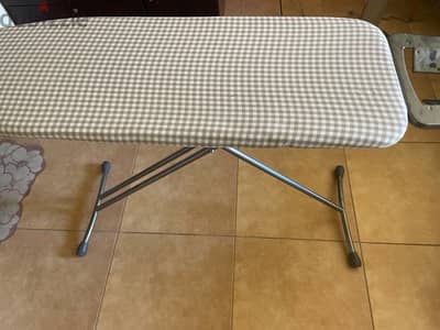 about 2 month used ironing board with cover