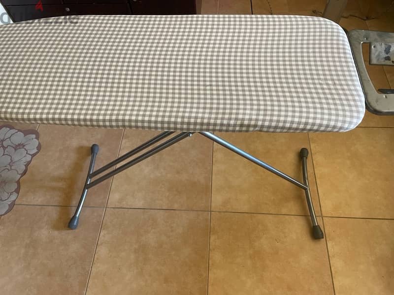 about 2 month used ironing board with cover 0