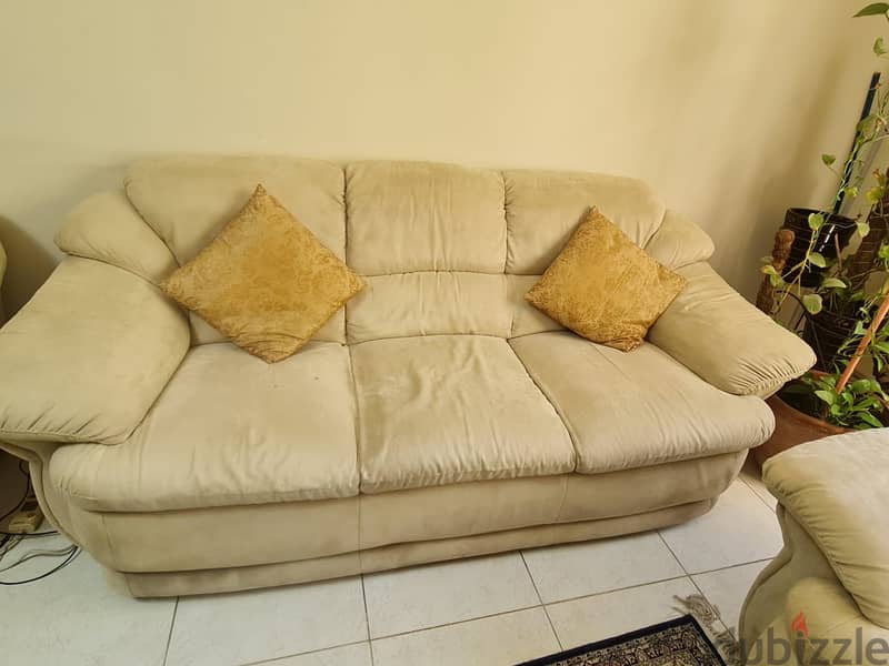 Cream white colored sofa 2