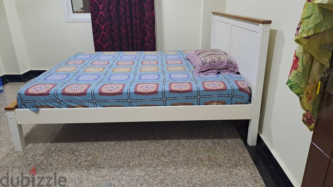 King size wooden bed and spring mattress 1 yr old and 3 month only us 2