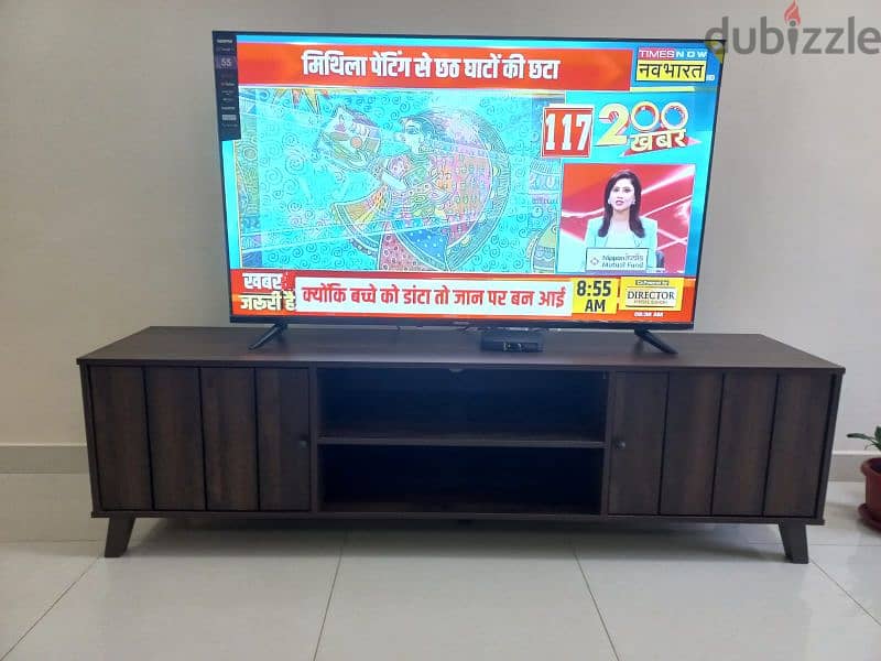 4 month used 55" led smart tv, Geepas brand plus tv stand 0