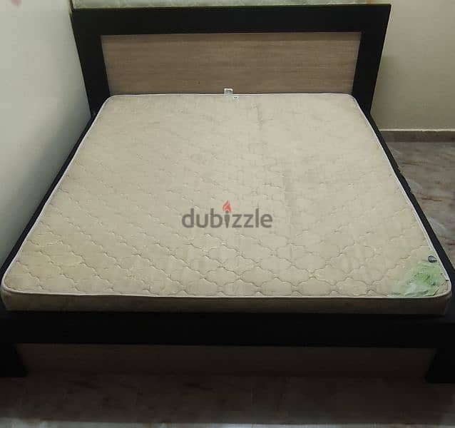 King size bed with a mattress. 2