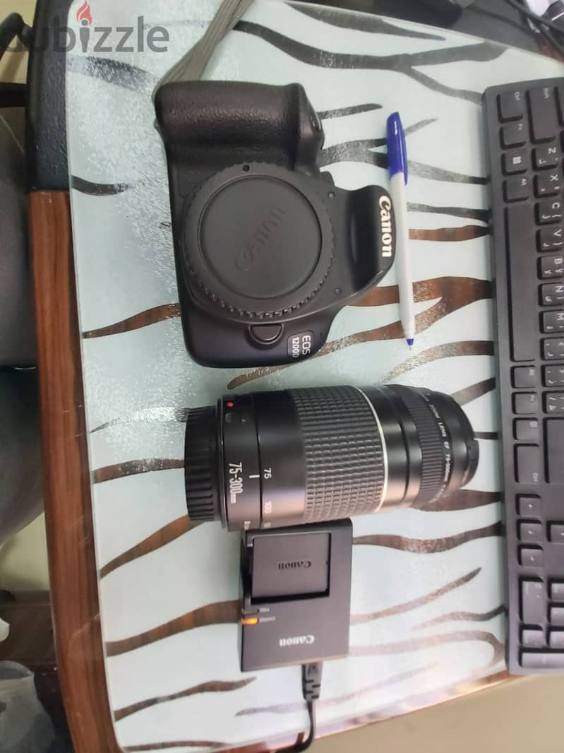 Very clean Canon EOS 1200 D with Powerful longrange Lens 7