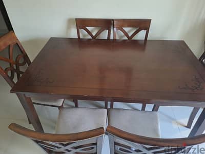 Wooden dining table with 6 chairs for sale @ 70 rials