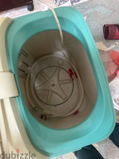 small washing machine and kids cycle