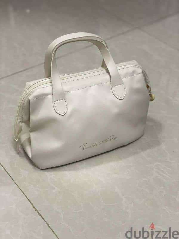 white fashionable hand bag 0