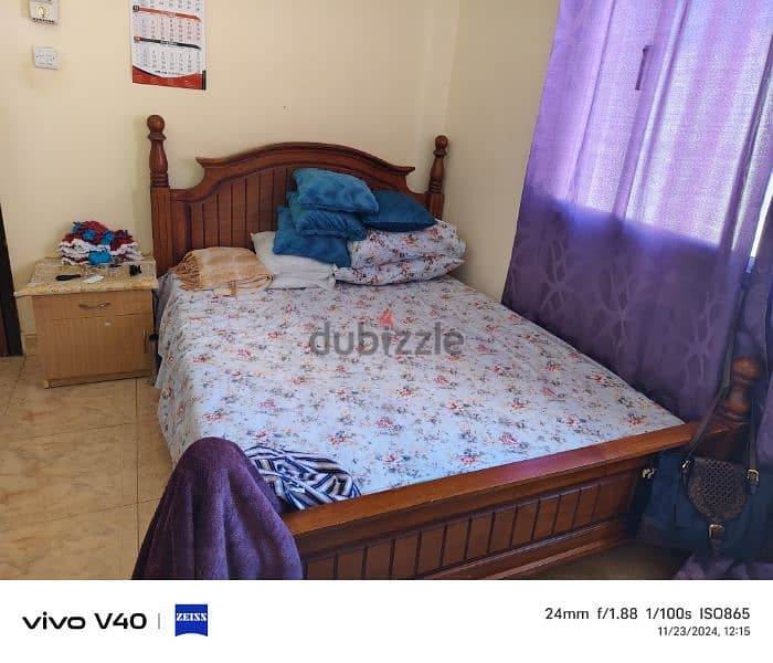 queen size bed with mattress and side table 0