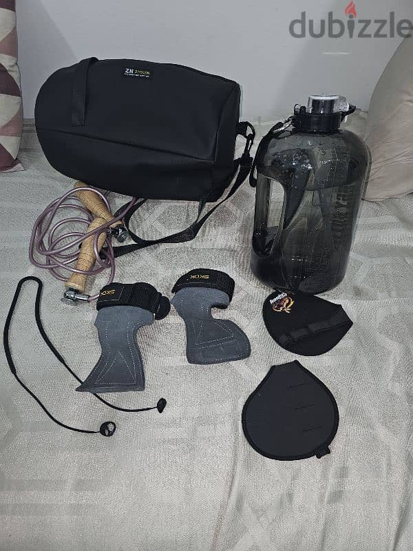 Gym accessories, shaker, gym bag, water bottle, lifting straps. 0