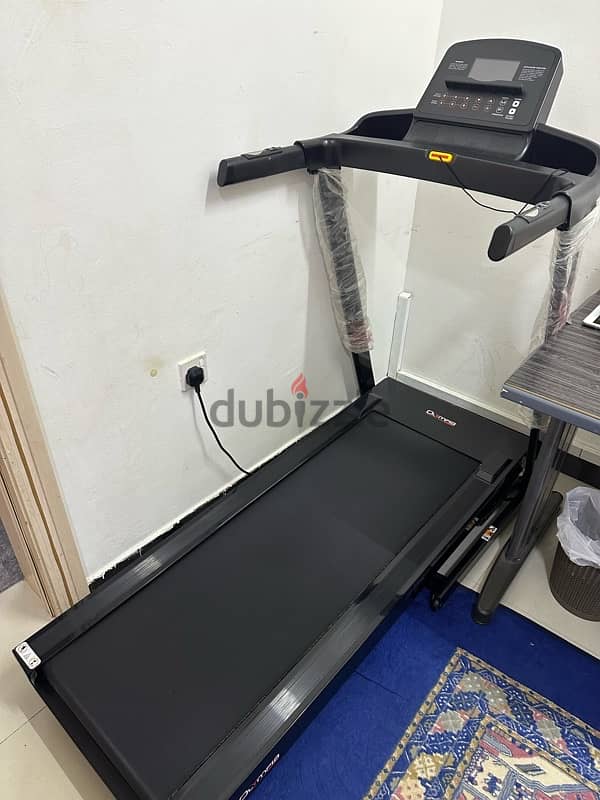 olympia treadmil with dumbells 2