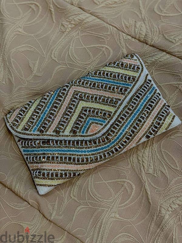 clutches مصنوعة يدوياً بحب 5