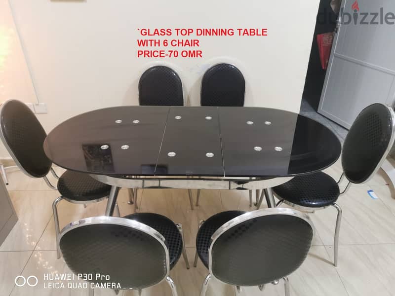 Extendable tinted glass top table with steel legs, with six beautiful 0