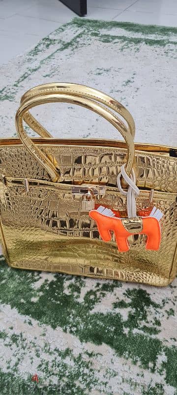 شنطة يد هيرمس ذهبى موديل جديد New model gold herme`s paris handbag