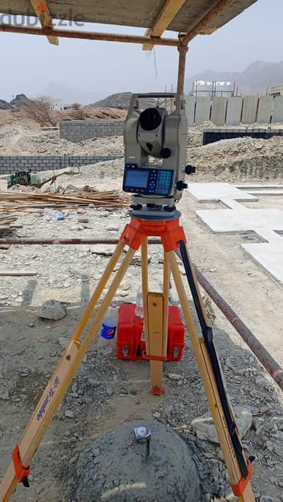 Land Surveyor with instrument