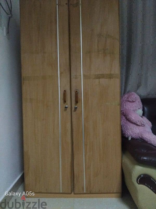 two door wardrob with one dresding table and smalll wooden table 1