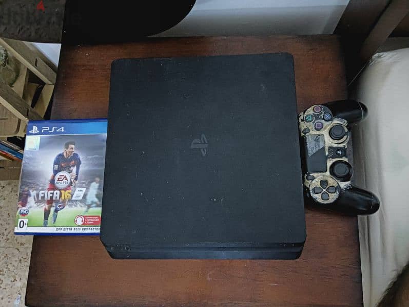 PS4 with FIFA 16 and a controller 3