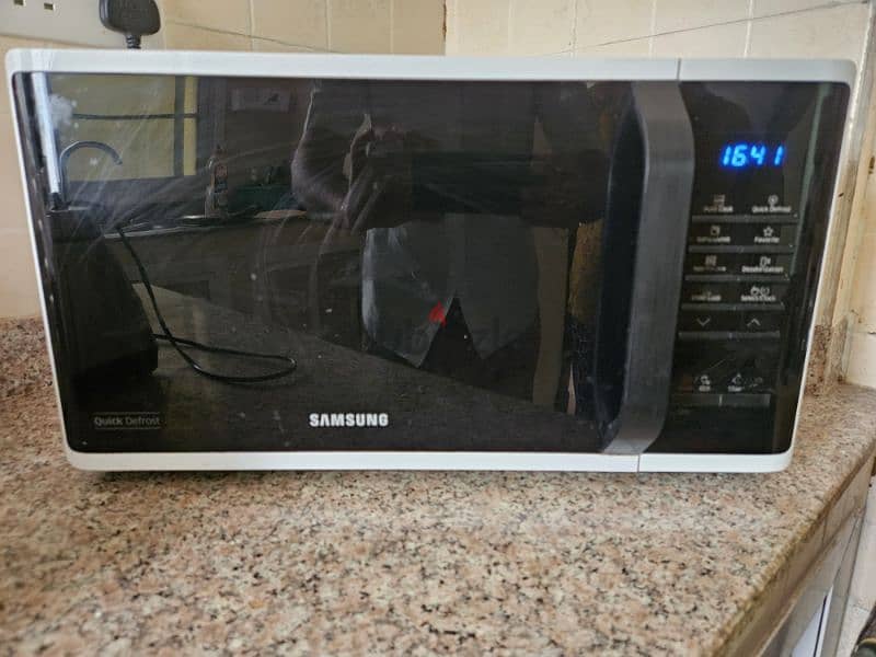 sofa, cooking range, microwave and trademill 1