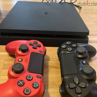 Playstation 4 slim jet black with 2 controllers orginal interested