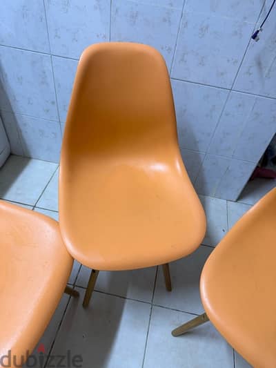 Four comfortable light chairs.