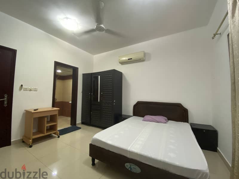 Fully Furnished spacious room + private attached bathroom in Al Ghubra 1