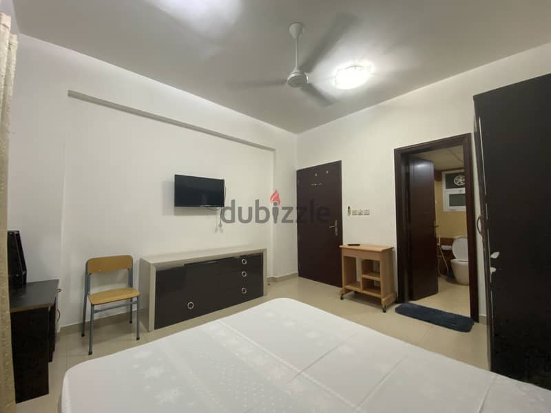 Fully Furnished spacious room + private attached bathroom in Al Ghubra 2