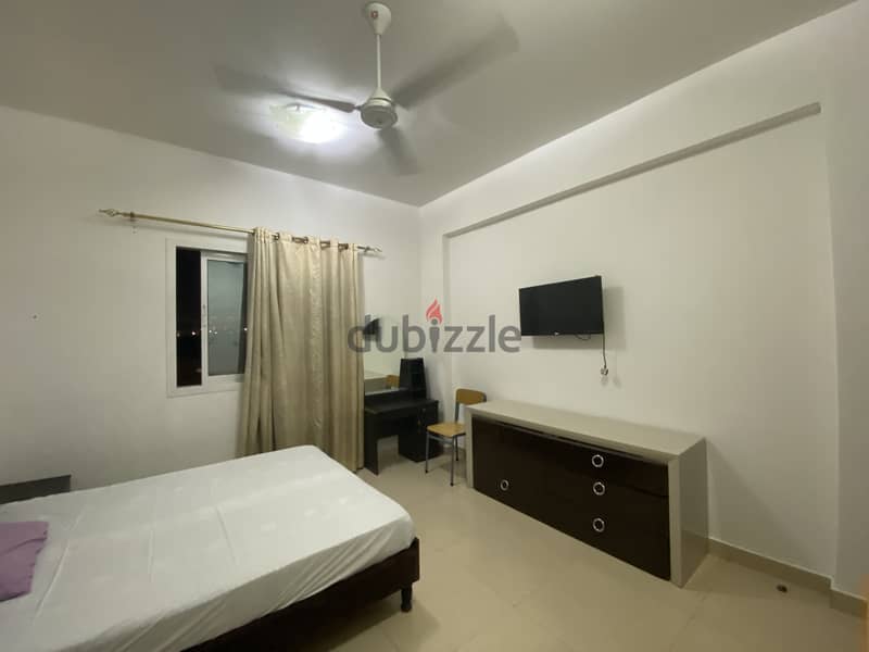 Fully Furnished spacious room + private attached bathroom in Al Ghubra 3