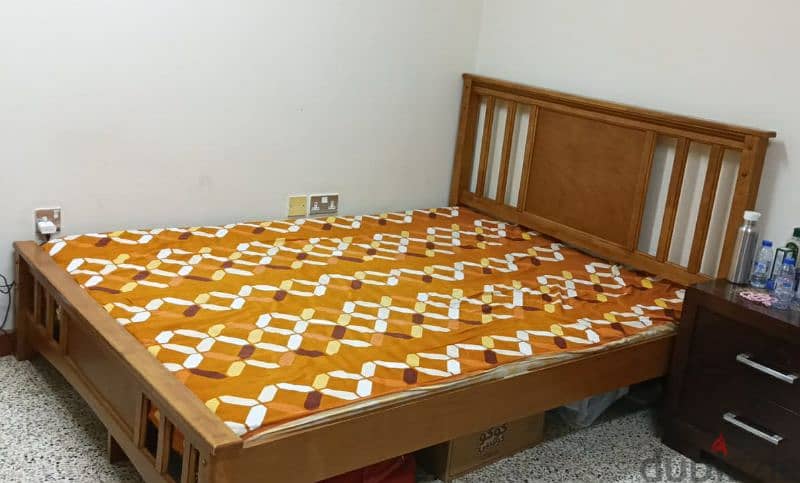 Queen size bed, dining table with four chairs, chair 0