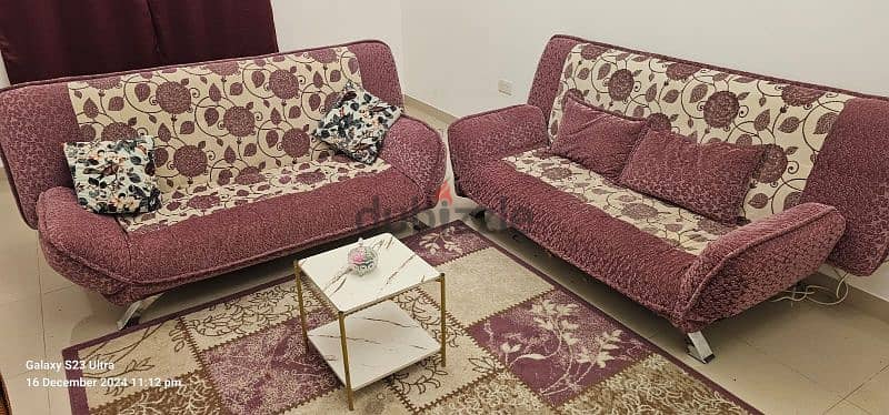 sofa convertible bed with 4 pillows,carpet,and teapot table 1