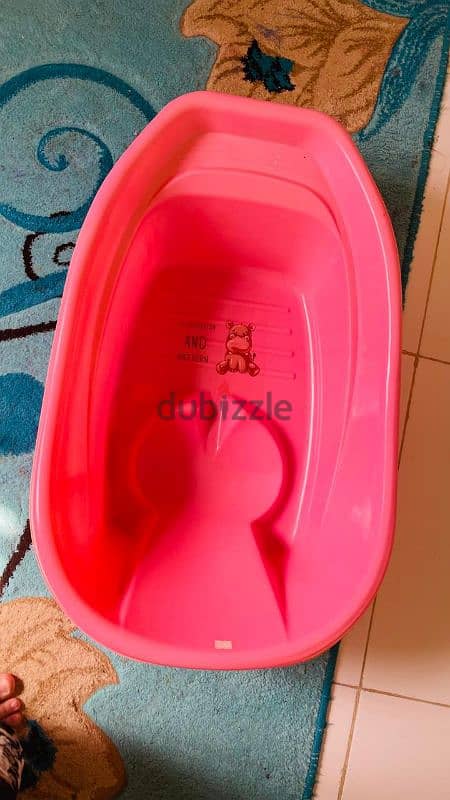 Baby walker, cycle, and bathtub for sale 1