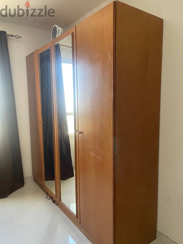 4 door wooden cupboard. good condition 1