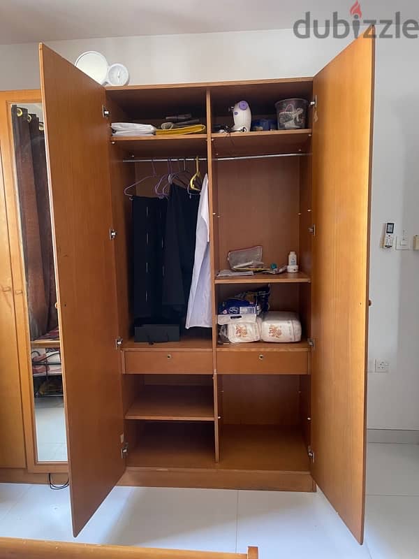 4 door wooden cupboard. good condition 2